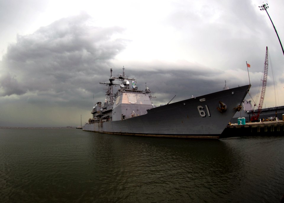 US Navy 090609-N-7705S-187 Storm clouds loom on the horizon behind the Ticonderoga-class guided-missile cruiser USS Monterey (CG 61) at Naval Station Norfolk