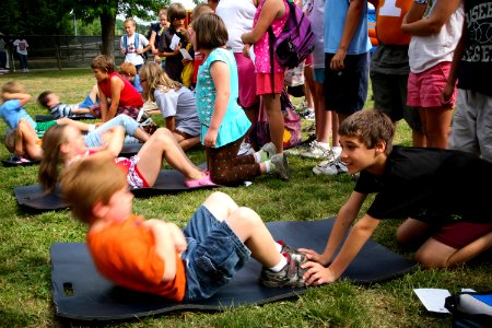 US Navy 090611-N-3271W-003 Local area children test their fitness skills during a Junior Seal Fitness photo