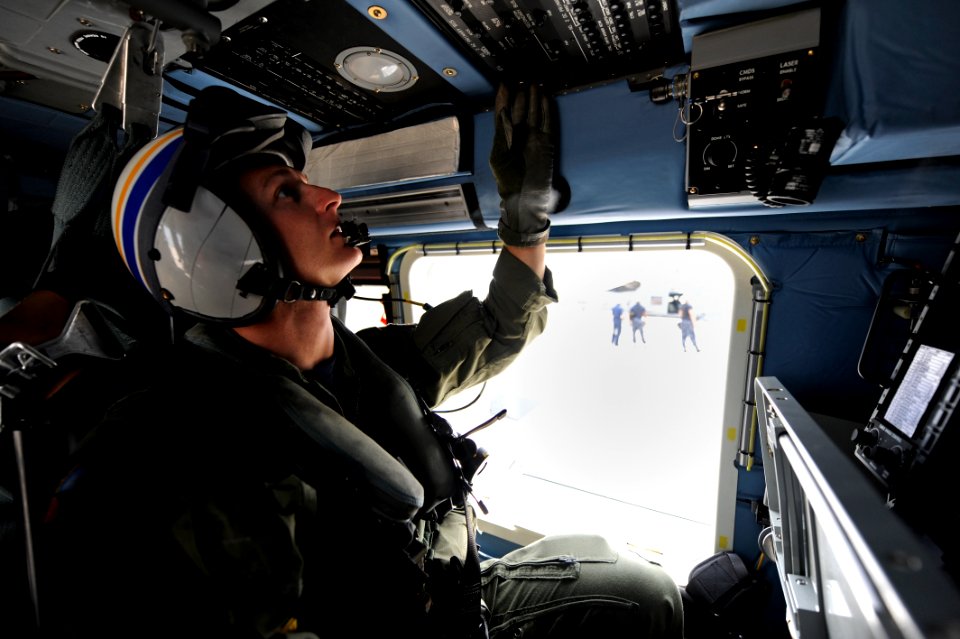 US Navy 090610-N-0413R-109 Naval Air Crewman 3rd Class William Morrison goes through his pre-flight checks before take off at Naval Air Station Jacksonville, Fla