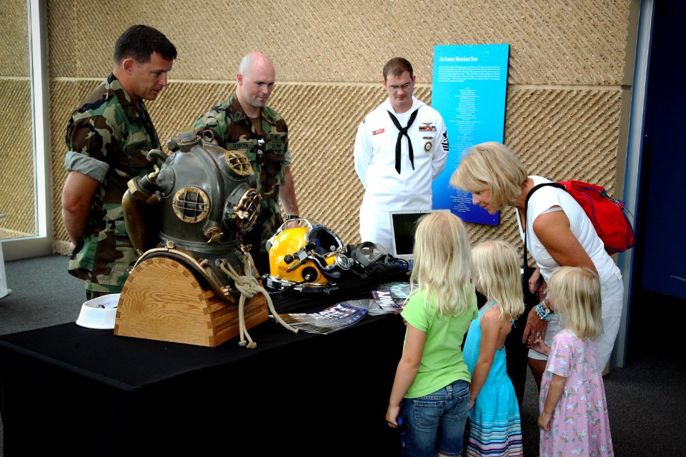 US Navy 090608-N-3271W-080 Chief Warrant Officer Tim Andros and Navy Diver 1st Class Chris Staten, both assigned to Mobile Diving and Salvage Unit (MDSU) 2 based in Little Creek, Va., show some of their diving equipment to Tenn