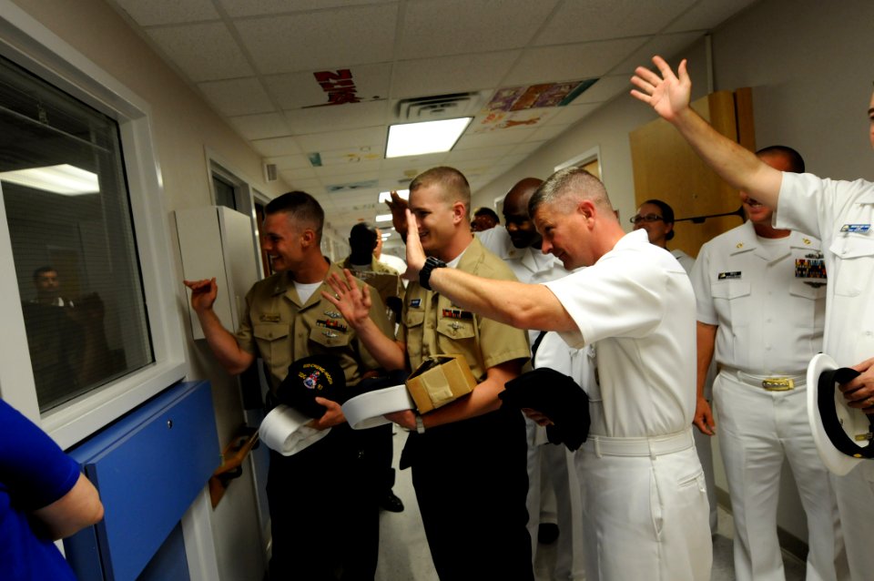 US Navy 090610-N-9818V-235 Master Chief Petty Officer of the Navy (MCPON) Rick West and Sailors participating in Chattanooga Navy Week 2009 wave to a patient at T.C. Thompson Children's Hospital