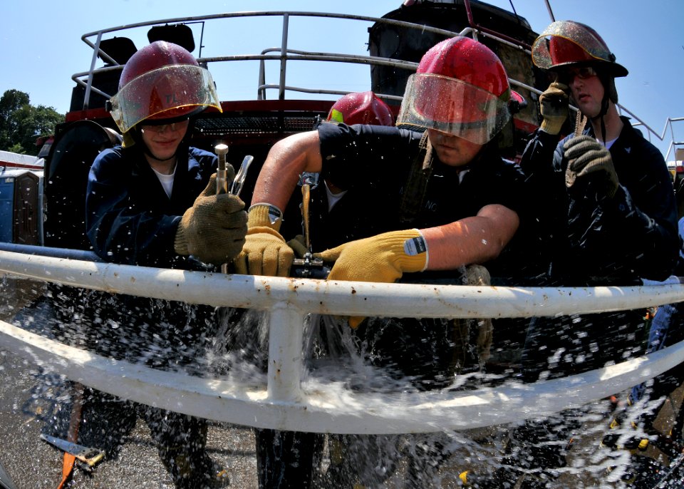 US Navy 090611-N-1745W-013 Sailors of the USS Abraham Lincoln (CVN 72) patch a bursting water pipe during a wet trainer simulation held by Fremont Maritime Services