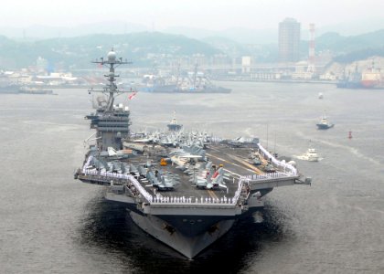 US Navy 090610-N-9565D-033 Sailors man the rails aboard the aircraft carrier USS George Washington (CVN 73) during the ship's departure from Fleet Activities Yokosuka