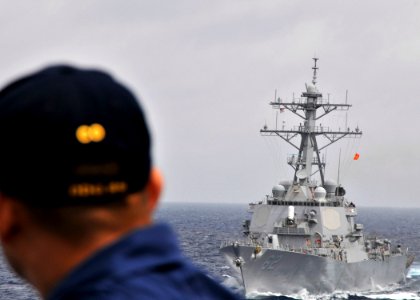 US Navy 090611-N-2638R-001 commanding officer of Arleigh Burke-class guided-missile destroyer USS Mustin (DDG 89) watches as Arleigh Burke-class guided-missile destroyer USS Fitzgerald (DDG 62) commences a starboard approach photo