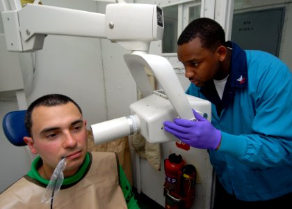 US Navy 090611-N-6720T-019 Hospital Corpsman 2nd Class Calvin Harris performs an x-ray on Aviation Machinist's Mate 1st Class Mario Arias aboard the aircraft carrier USS George Washington (CVN 73) photo