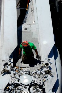 US Navy 090612-N-9132C-033 Aviation Machinist's Mate Airman Apprentice James Fuller works on an SH-60F Sea Hawk helicopter