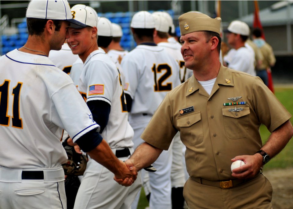 US Navy 090615-N-1229B-024 Aviation Electrician's Mate Senior Chief Gregory Sterling from Leesville, La. shakes hands with players from the Kitsap Bluejackets during military appreciation night for the Bluejackets