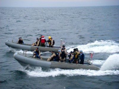 US Navy 090611-N-5624R-003 Members of the visit, board, search and seizure team from the guided-missile destroyer USS Forrest Sherman (DDG 98) return to Forrest Sherman