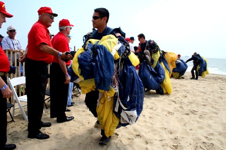 US Navy 090614-N-5366K-007 Aircrew Survival Equipmentman 1st Class Victor Maldonado, assigned to the U.S. Navy Parachute Team, the Leap Frogs, and other members of the team greet Marine Corps veterans