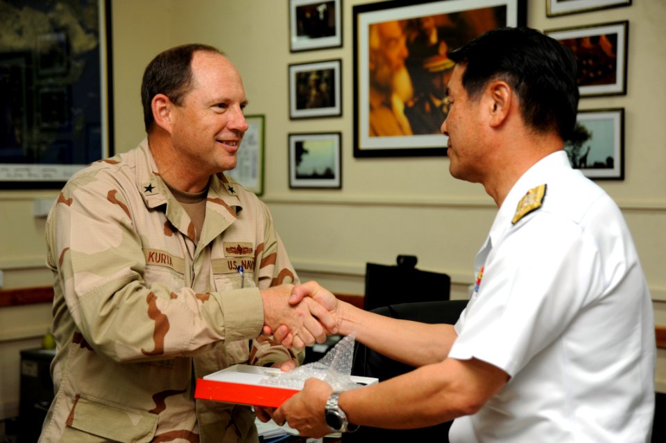 US Navy 090615-N-2420K-021 Rear Adm. Anthony Kurta, commander, Combined Joint Task Force-Horn of Africa, shakes hands with Vice Adm. Tohru Izumi, commander-in-chief of the Japan Maritime Self-Defense Force Self-Defense Fleet