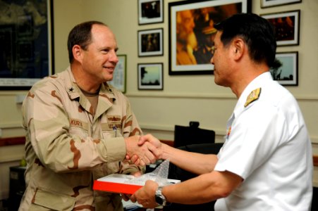 US Navy 090615-N-2420K-021 Rear Adm. Anthony Kurta, commander, Combined Joint Task Force-Horn of Africa, shakes hands with Vice Adm. Tohru Izumi, commander-in-chief of the Japan Maritime Self-Defense Force Self-Defense Fleet