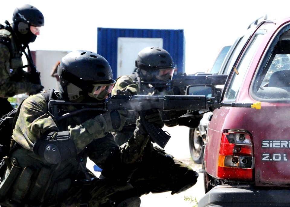US Navy 090615-N-6138K-618 Finnish Navy boarding team members Cpl. Petri Linna, left, and Sgt. Joonas Moinaneu lay down suppressing fire while their team members move forward during a disaster training exercise