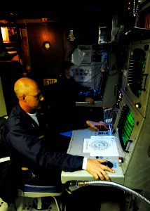 US Navy 090616-N-7092S-031 Senior Chief Sonar Technician Surface Anthony Beggs, left, and STG3 Joshua Colantuano monitor data from the tactical towed array sonar aboard the guided-missile frigate USS Kauffman (FFG 59)