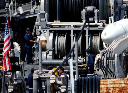 US Navy 090617-N-0807W-021 Sailors assigned to the Avenger-class mine countermeasures ship USS Patriot (MCM 7) reel in an electromagnetic mine sweep cable