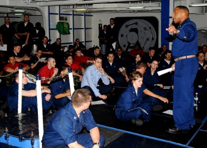 US Navy 090617-N-1062H-022 Chief Boatswain's Mate Damon Carter, assigned to the deck department of the aircraft carrier USS George Washington (CVN 73), instructs junior Sailors on the responsibilities of standing anchor watch