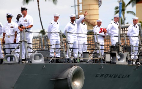 US Navy 090615-N-3666S-043 Sailors man the rails aboard the guided-missile frigate USS Crommelin (FFG 37) as she departs Naval Station Pearl Harbor for a scheduled six-month deployment as part of the Mid-Pacific Surface Combata