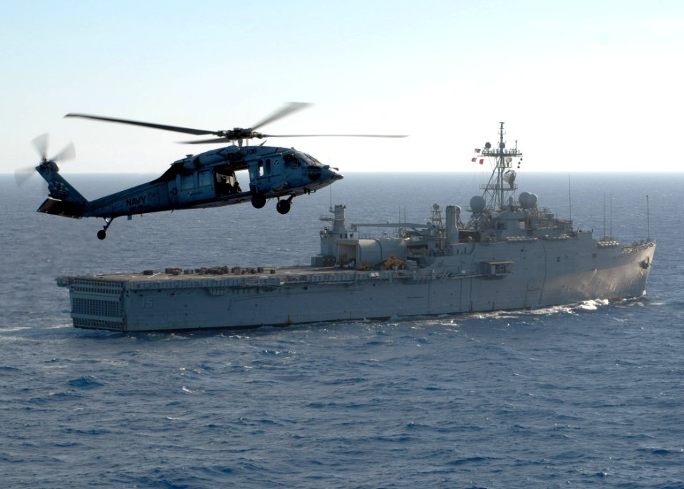 US Navy 090616-N-3165S-040 An MH-60B Sea Hawk helicopter transfers a pallet of supplies from the multi-purpose amphibious assault ship USS Bataan (LHD 5) to the the amphibious transport dock ship USS Ponce (LPD 15)
