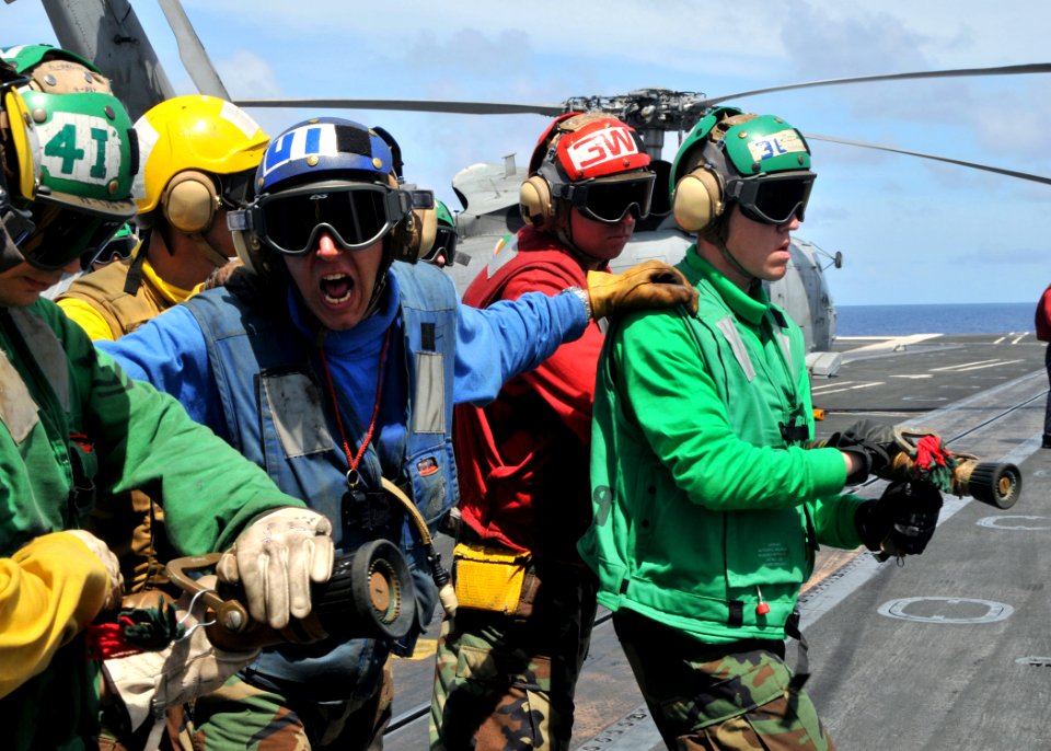 US Navy 090619-N-8534H-036 Aviation Boatswain's Mate (Handling) 3rd Class Jason Enoch leads his hose team during a fire fighting drill aboard the aircraft carrier USS George Washington (CVN 73)