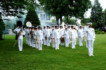 US Navy 090618-N-0773H-083 Capt. George N. Thompson, commanding officer of the U.S. Navy Ceremonial Band leads band members as they render honors during a 21-gun salute