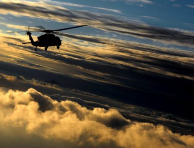 US Navy 090619-N-9928E-386 An MH-60S Sea Hawk helicopter from the Eightballers of Helicopter Sea Combat Squadron (HSC) 8, embarked aboard the aircraft carrier USS John C. Stennis (CVN 74), flies off the coast of Alaska