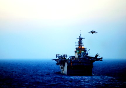 US Navy 090618-N-5345W-056 An AV-8B Harrier lands aboard the amphibious assault ship USS Bataan (LHD 5) during evening flight operations