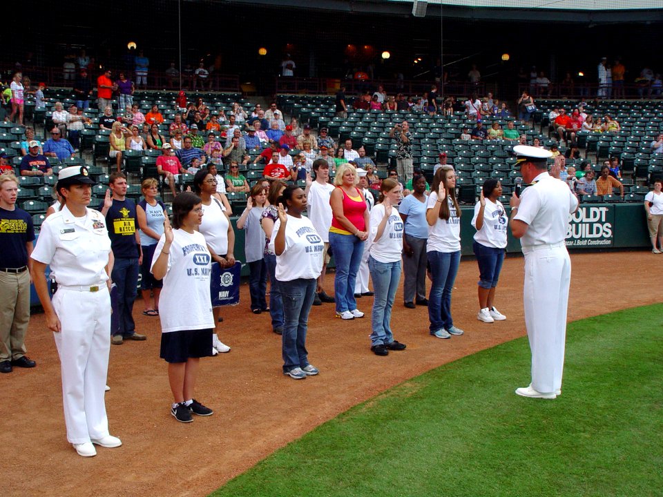 US Navy 090620-N-2888Q-031 Cmdr. Mike Mullins, right, commander, Navy Recruiting District Dallas, administers the Oath of Enlistment to 10 Delayed Entry Program members at the Bricktown Ballpark in Oklahoma City