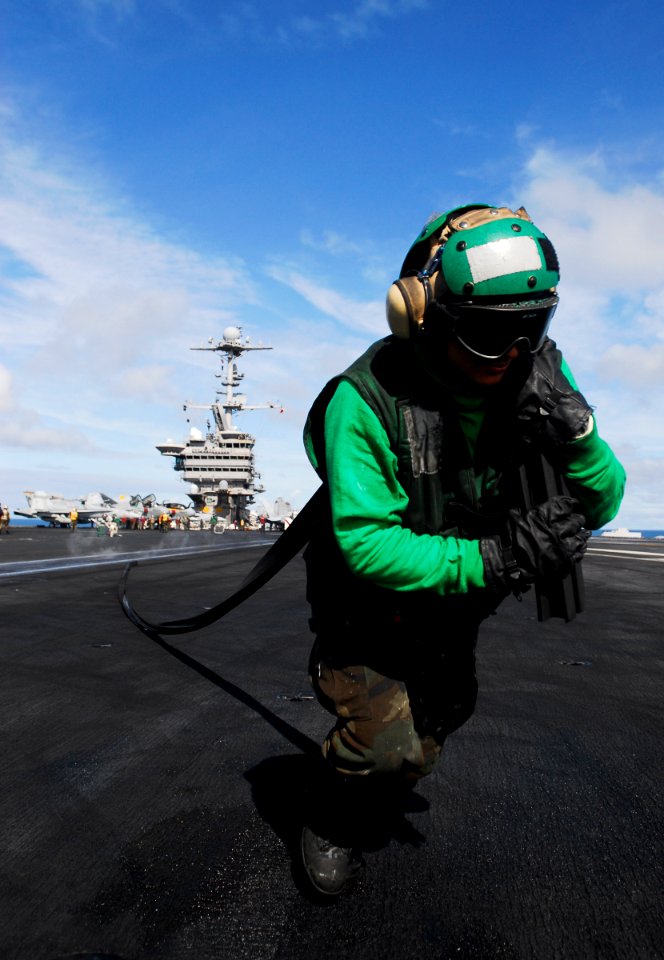 US Navy 090616-N-6538W-016 Aviation Boatswain's Mate (Equipment) Airman Apprentice Angela Fuga, from St. Clair, Mich., removes a protective rubber gasket used to keep out foreign object debris from catapult one