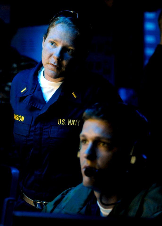 US Navy 090619-N-5345W-111 Ensign Amee Johnson monitors the movements of simulated hostile contacts with Lt.j.g. Ethan Blankenship