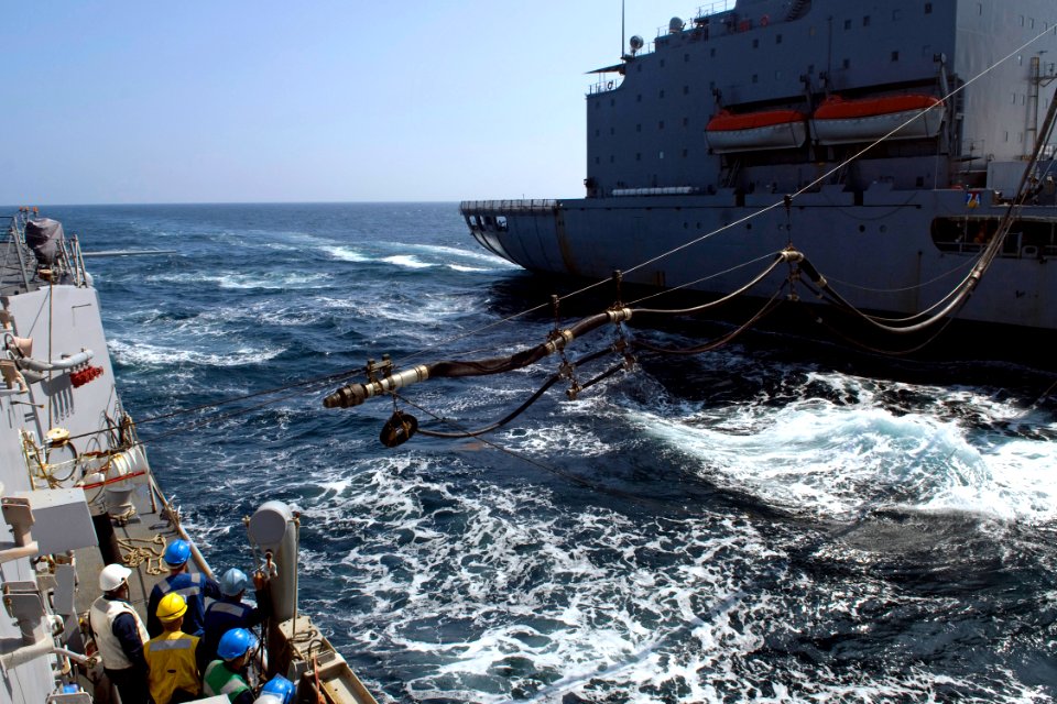 US Navy 090619-N-9123L-049 Sailors aboard the guided-missile destroyer USS McCampbell (DDG 85) receive a fuel line from the Military Sealift Command fleet replenishment oiler USNS Rappahannock (T-AO 204)