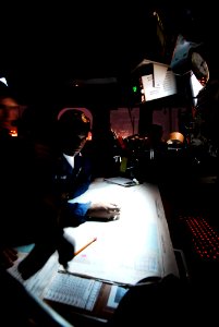 US Navy 090618-N-7092S-025 Quartermaster 2nd Class Pete Seaman plots a course out of Callao, Peru aboard guided-missile frigate USS Kauffman (FFG 59)