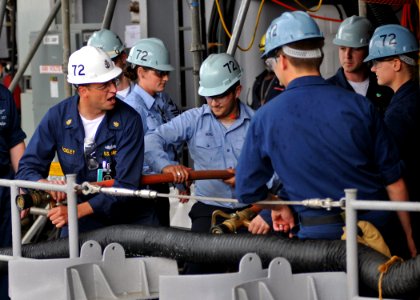 US Navy 090618-N-1229B-070 Damage Controlman Chief Patrick Buckley of Bellingham, Wash. instructs Sailors of aircraft carrier USS Abraham Lincoln (CVN 72) firefighting techniques during training stations