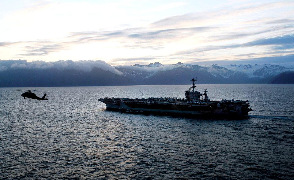 US Navy 090619-N-9928E-579 An MH-60S Sea Hawk helicopter from the Eightballers of Helicopter Sea Combat Squadron (HSC) 8 flies near the aircraft carrier USS John C. Stennis (CVN 74) as the ship is underway off the coast of Alas