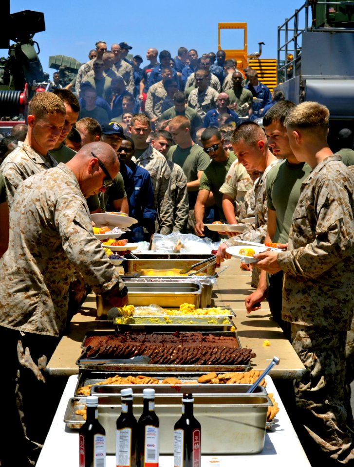 US Navy 090621-N-5345W-005 Sailors and Marines line up for a steak and lobster feast during a Father's Day steel beach picnic
