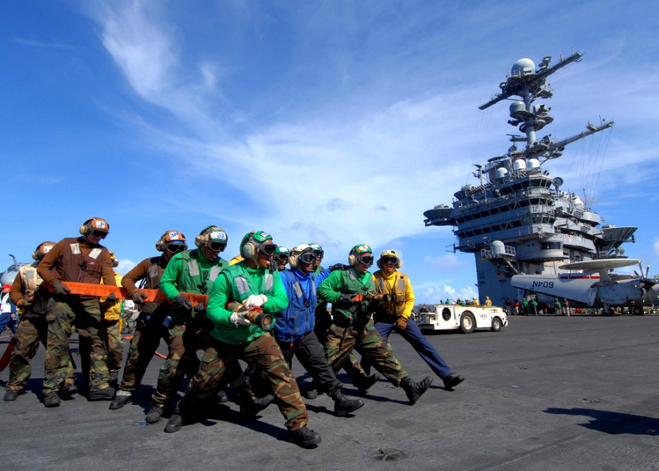 US Navy 090618-N-6720T-082 Sailors assigned to the air department aboard the aircraft carrier USS George Washington (CVN 73) simulate fighting an aircraft fire during a general quarters drill