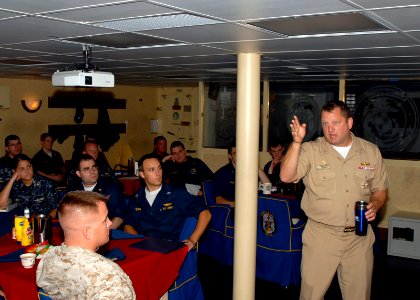 US Navy 090621-N-0924R-006 Capt. Brad Williamson, commodore, Destroyer Squadron 2, conducts surface warfare officers training during a mentoring session with junior officers aboard the amphibious dock landing ship USS Oak Hill