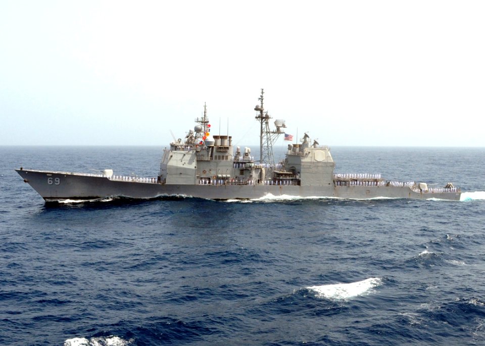 US Navy 090622-N-9988F-003 Sailors aboard the guided-missile cruiser USS Vicksburg (CG 69) render honors to Master Chief Jeffrey J. Garber as the ship pulls along side the aircraft carrier USS Dwight D. Eisenhower (CVN 69)