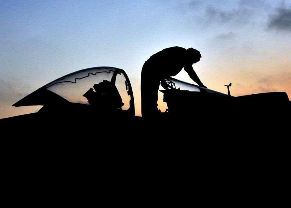 US Navy 090619-N-9740S-111 A Marine plane captain performs post-flight maintenance on an AV-8B Harrier aboard the multi-purpose amphibious assault ship USS Bataan (LHD 5)