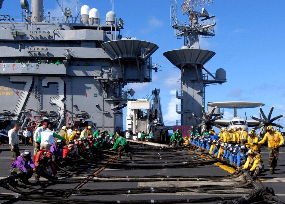 US Navy 090618-N-6720T-062 Sailors assigned to the air department aboard the aircraft carrier USS George Washington (CVN 73) prepare to raise a Ready-Jet aircraft barricade during a general quarters drill