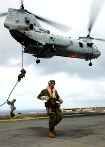 US Navy 090622-N-5253W-014 Marines assigned to the 31st Marine Expeditionary Unit (31st MEU) fast-rope onto the flight deck of the amphibious assault ship USS Essex (LHD 2)