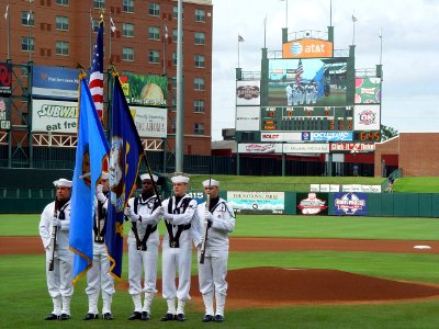 US Navy 090620-N-2888Q-030 Members of the Navy color guard of Strategic Communications Wing ONE (TACAMO) at Tinker Air Force Base, parade the colors at the Bricktown Ballpark in Oklahoma City photo