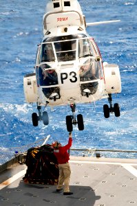 US Navy 090618-N-9689V-006 Embarked Presidential Airways Puma Vertical Takeoff and Replenishment Team practice maneuvers aboard the Military Sealift Command dry cargo-ammunition ship USNS Richard E. Byrd (T-AKE 4) in preparatio