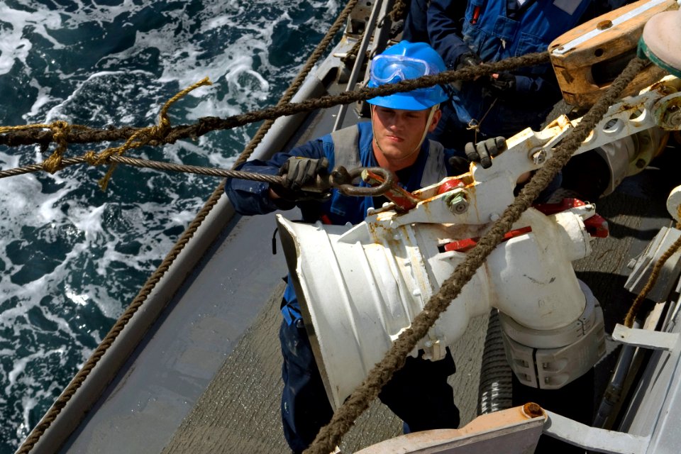 US Navy 090619-N-9123L-040 Boatswain's Mate 3rd Class Brett Butler, from Tallahassee, Fla., attaches span wire to a fuel probe aboard the guided-missile destroyer USS McCampbell (DDG 85) during an underway replenishment