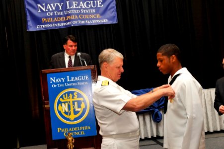 US Navy 090624-N-8273J-109 Chief of Naval Operations (CNO) Adm. Gary Roughead, presents Ramee Gregory with the Navy League Youth Medal during the 2009 annual Navy League Dinner in Philadelphia, Penn