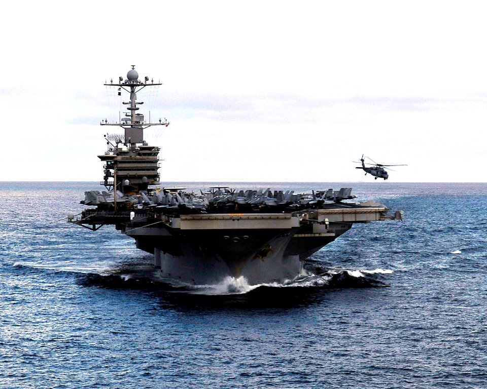 US Navy 090619-N-9928E-190 An MH-60S Sea Hawk helicopter from the Eightballers of Helicopter Sea Combat Squadron (HSC) 8 takes off from the aircraft carrier USS John C. Stennis (CVN 74)