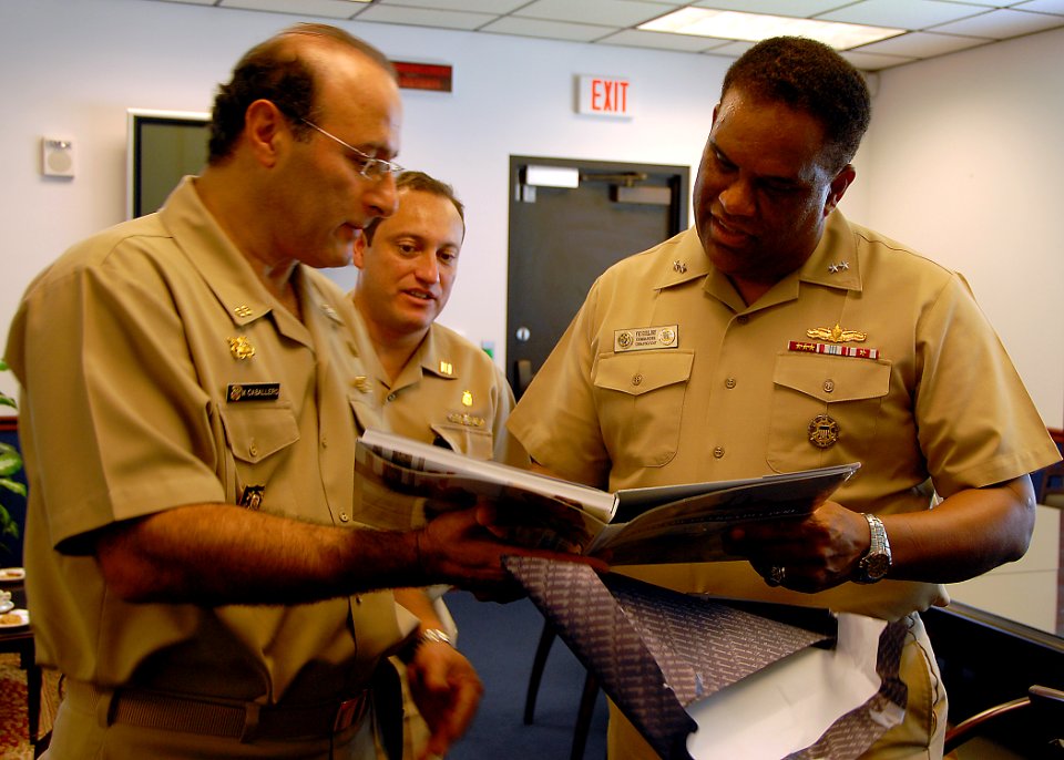 US Navy 090623-N-2821G-034 Peruvian Navy Rear Adm. Mario Luis Caballero Ferioli presents a gift to Rear Adm. Victor G. Guillory during an office call meeting