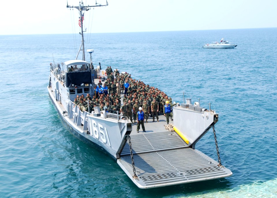 US Navy 090623-N-5207L-008 Sailors from the Royal Malaysian Navy and soldiers from the 9th Royal Malay Regiment arrive aboard Utility Landing Craft LCU 1651 for a tour of the dock landing ship USS Harpers Ferry (LSD 49)