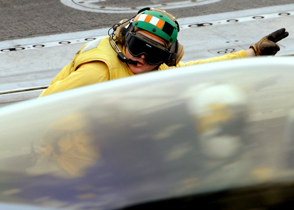 US Navy 090620-N-1062H-028 Lt. Marc Henderson gives the signal to launch an F-A-18E Super Hornet assigned to the Royal Maces of Strike Fighter Squadron (VFA) 27 from the aircraft carrier USS George Washington (CVN 73)
