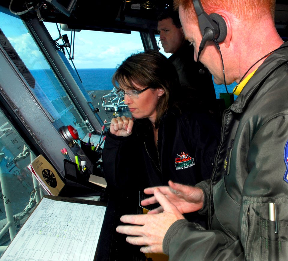US Navy 090622-N-2475A-027 Alaska Gov. Sarah Palin, left, listens as Air Boss Capt. Gordon Smith, from Mercer Island, Wash., explains the responsibilities of coordinating aircraft movement on the flight deck