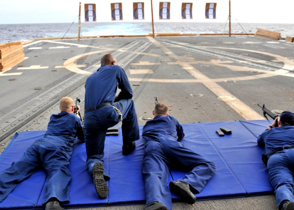 US Navy 090623-N-2638R-005 Sailors take aim at their targets during M16 service rifle qualifications aboard the guided-missile destroyer USS Mustin (DDG 89)
