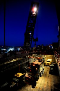 US Navy 090624-N-5345W-024 A medium tactical vehicle replacement is lifted from the well deck of the amphibious dock landing ship USS Fort McHenry (LSD 43)